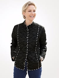 Quilted jacket with a muted leaf print