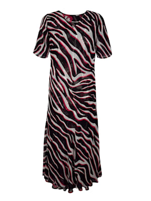 Vändbar klänning – ena sidan leopardmönstrad, andra sidan blommig